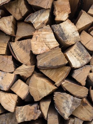 Background of an firewood dry and rough, cut in small pieces.