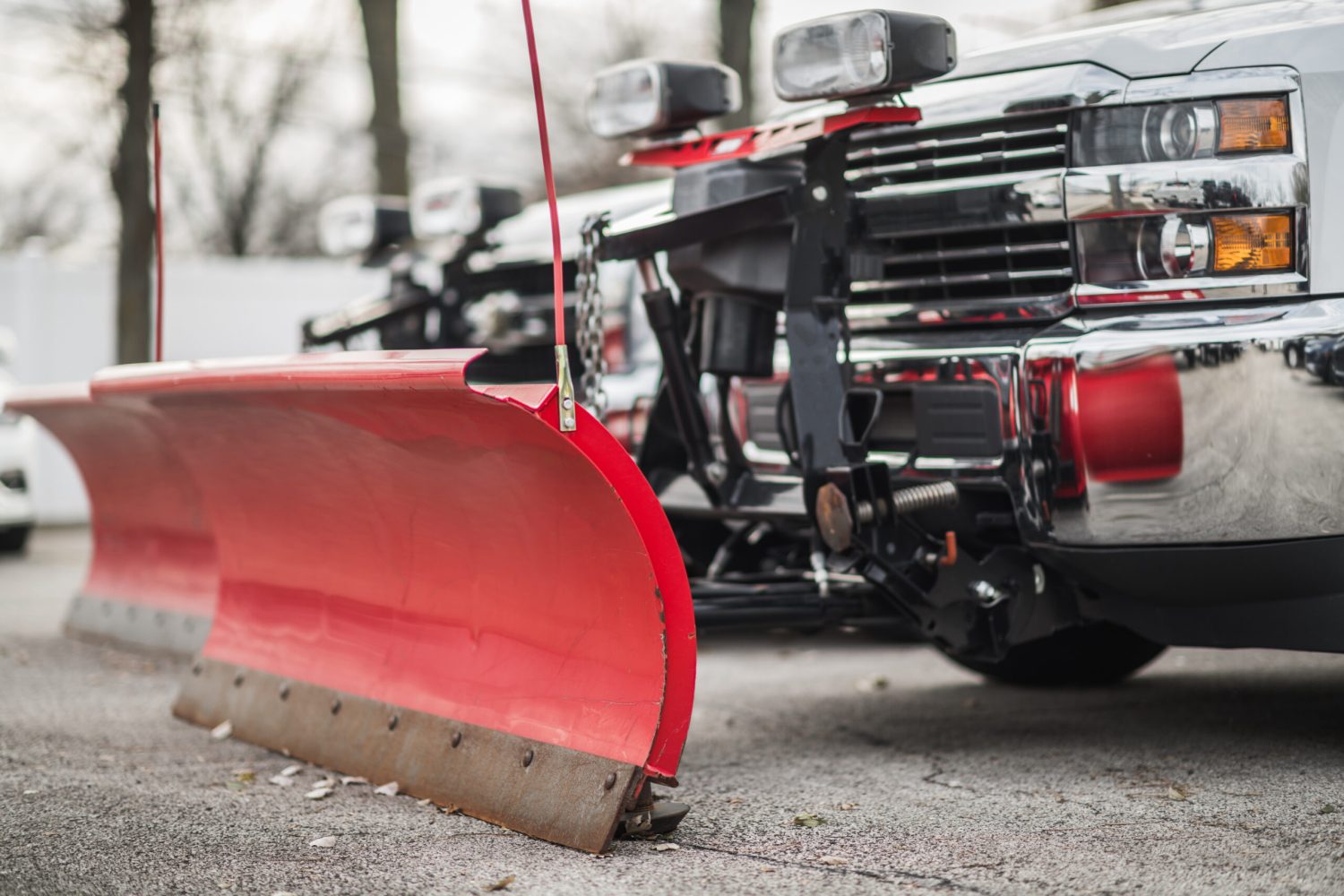 Snow Plow Pickup Trucks Awaiting Winter Season. Commercial Grade Plowers. Transportation Industry Theme.